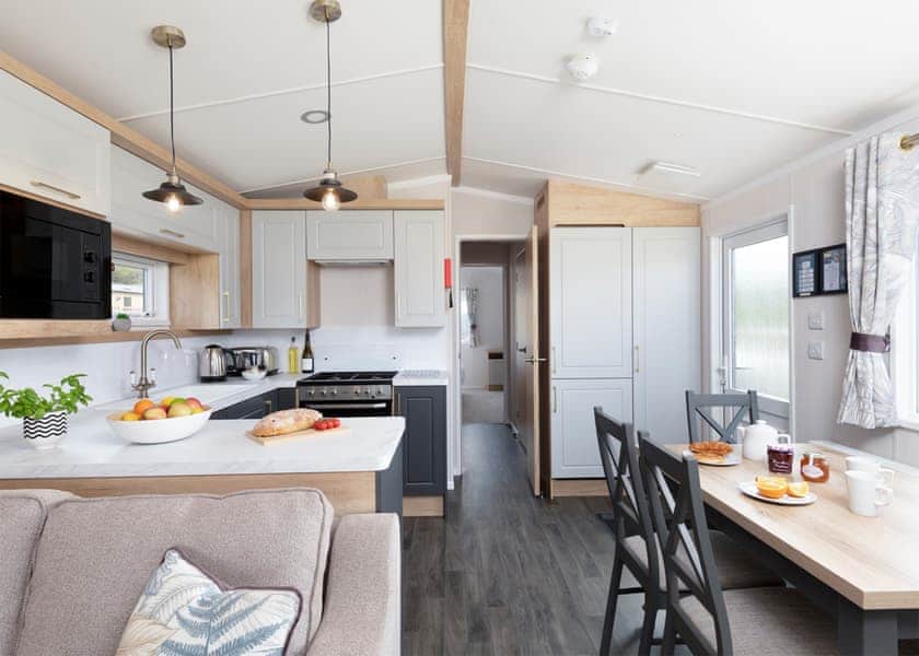 Please note: All imagery shown is a representation only. Style, decor and exact views vary by lodge | Willows Lake View 2 Bed Holiday Home - Clawford Lakes Resort and Spa, Clawton, Nr Holsworthy