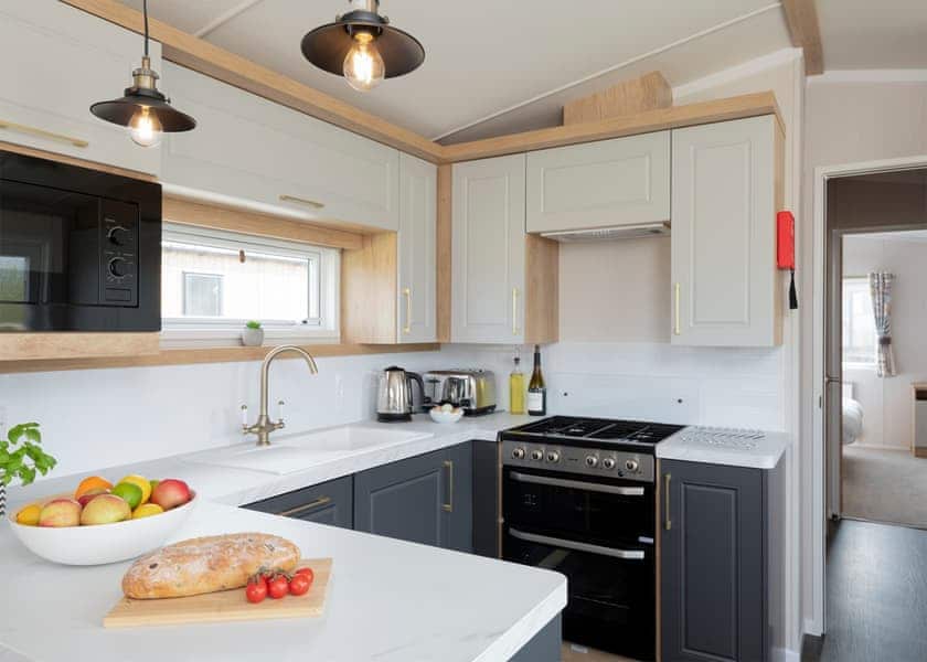 Please note: All imagery shown is a representation only. Style, decor and exact views vary by lodge | Willows Lake View 2 Bed Holiday Home - Clawford Lakes Resort and Spa, Clawton, Nr Holsworthy
