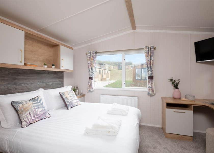 Please note: All imagery shown is a representation only. Style, decor and exact views vary by lodge | Willows Lake View 2 Bed Holiday Home - Clawford Lakes Resort and Spa, Clawton, Nr Holsworthy