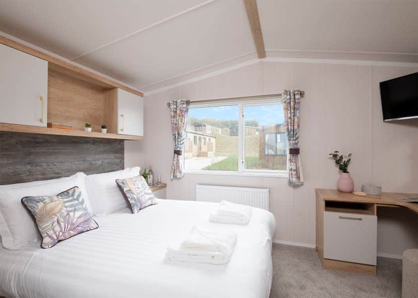 Please note: All imagery shown is a representation only. Style, decor and exact views vary by lodge | Willows 3 Bed Holiday Home - Clawford Lakes Resort and Spa, Clawton, Nr Holsworthy