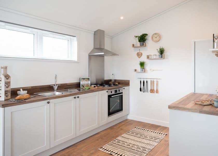 All imagery shown is a representation only. Style, decor and exact views vary by lodge | Valley Park View 2 bed Hot Tub Pet (sleeps 4) - Lakeview Manor Lodges, Dunkeswell, Honiton