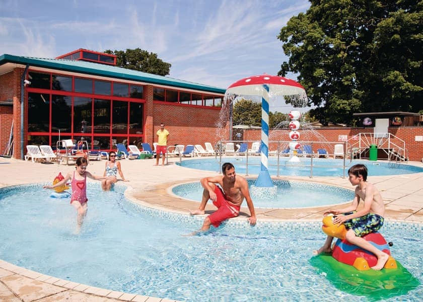 Outdoor swimming pool with water jets